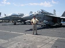 Mr Greg Odgers, our photographer for the day, in front on a Super Hornet.  It made his day.